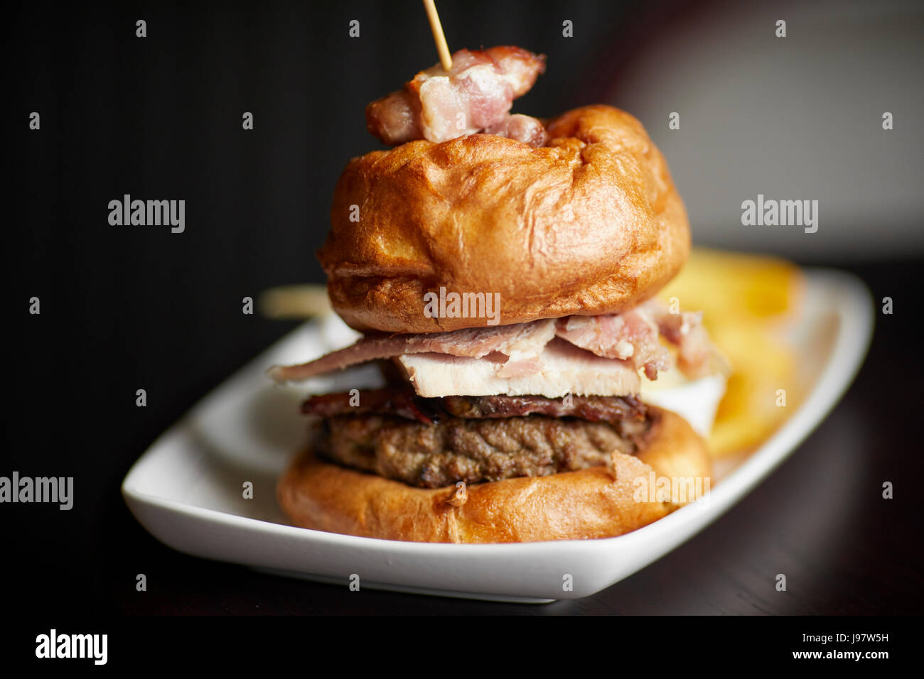 Traditional pub food, Burger and chips. Stock Photo
