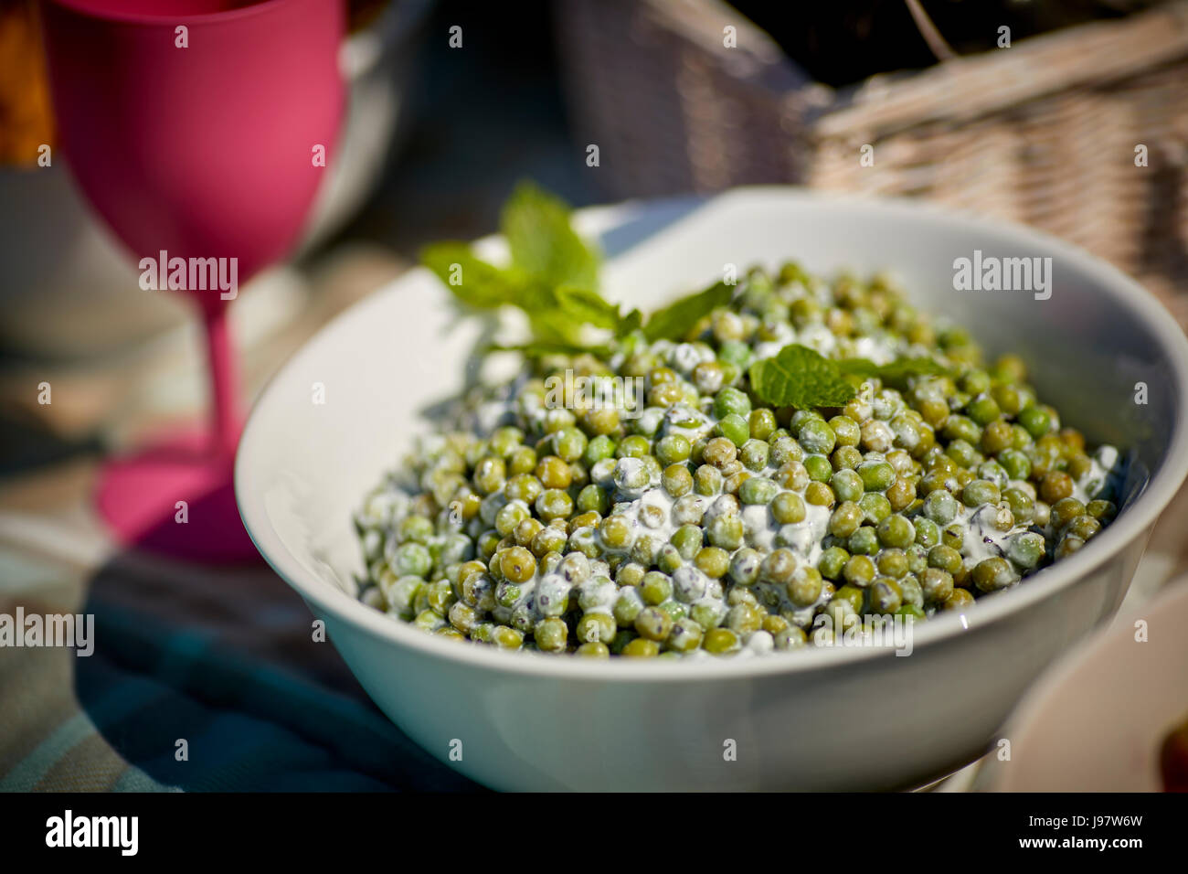 Traditional picnic food, with healthy options.peas with a dressing Stock Photo
