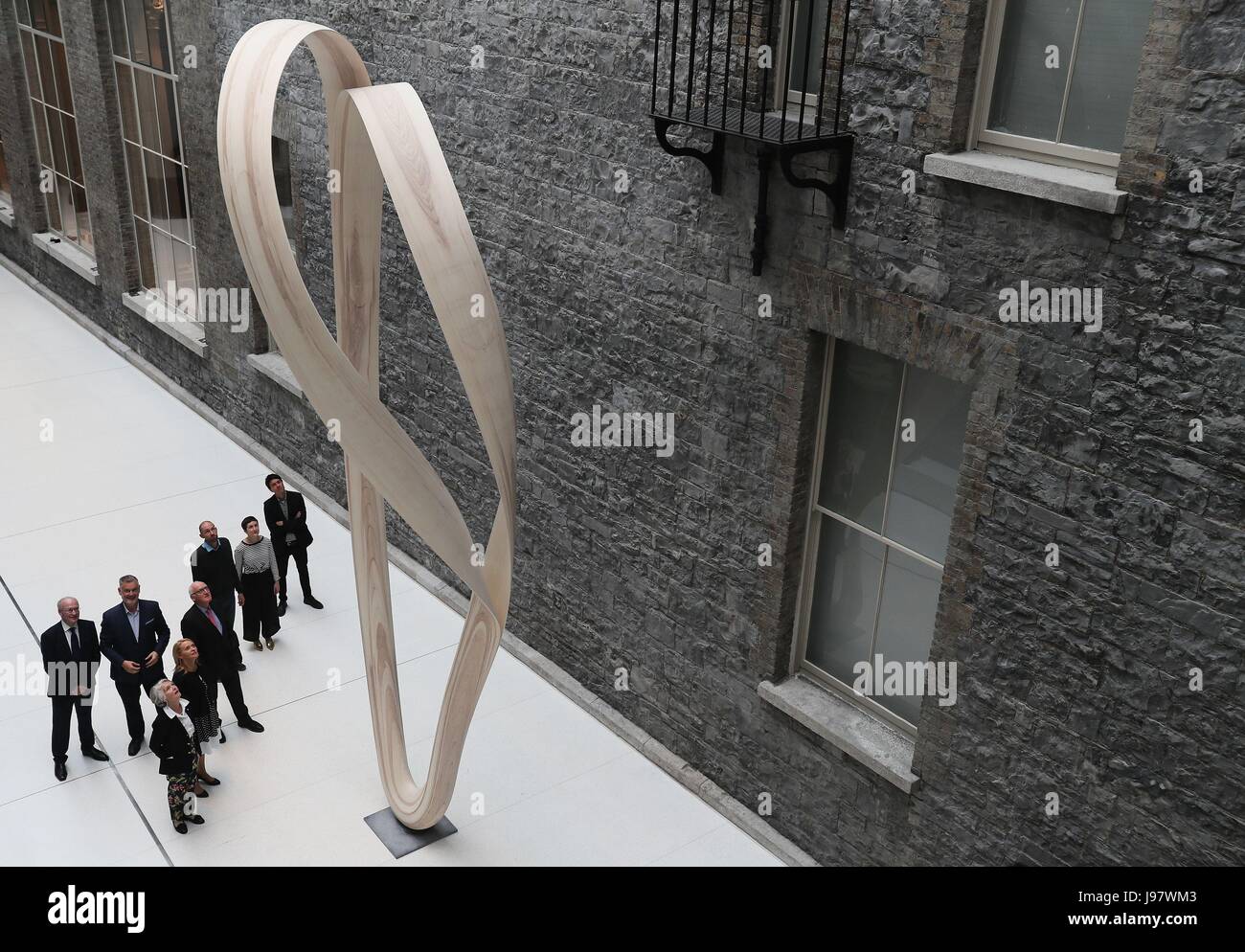 People view the sculptural design, Magnus Modus by Joseph Walsh, during a preview at the National Gallery of Ireland, Dublin. The piece was commissioned by the Office of Public Works on behalf of the gallery under the Per Cent for Art Scheme. Stock Photo