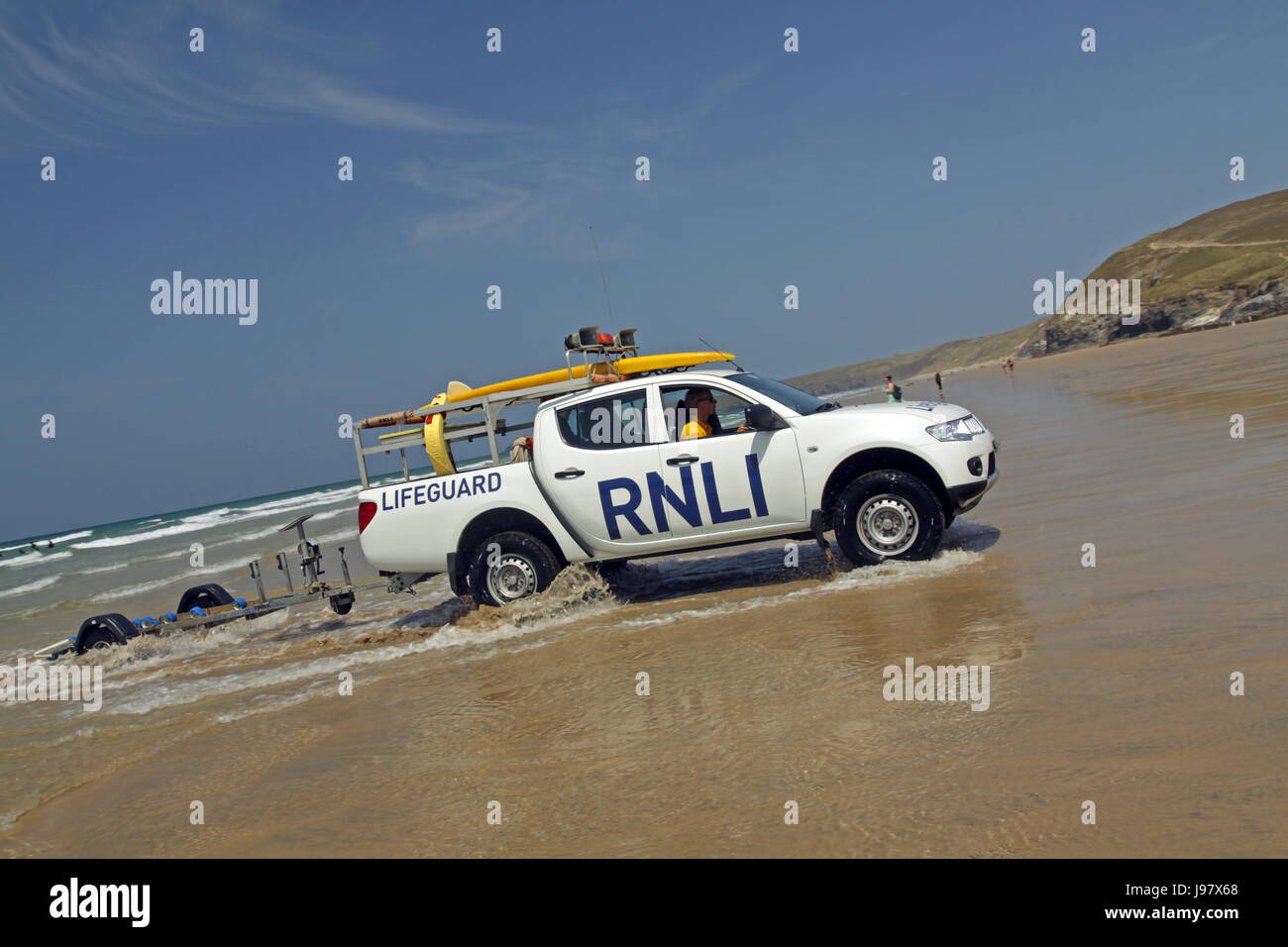 RNLI Lifeguards patrolling Cornish Beanch Stock Photo