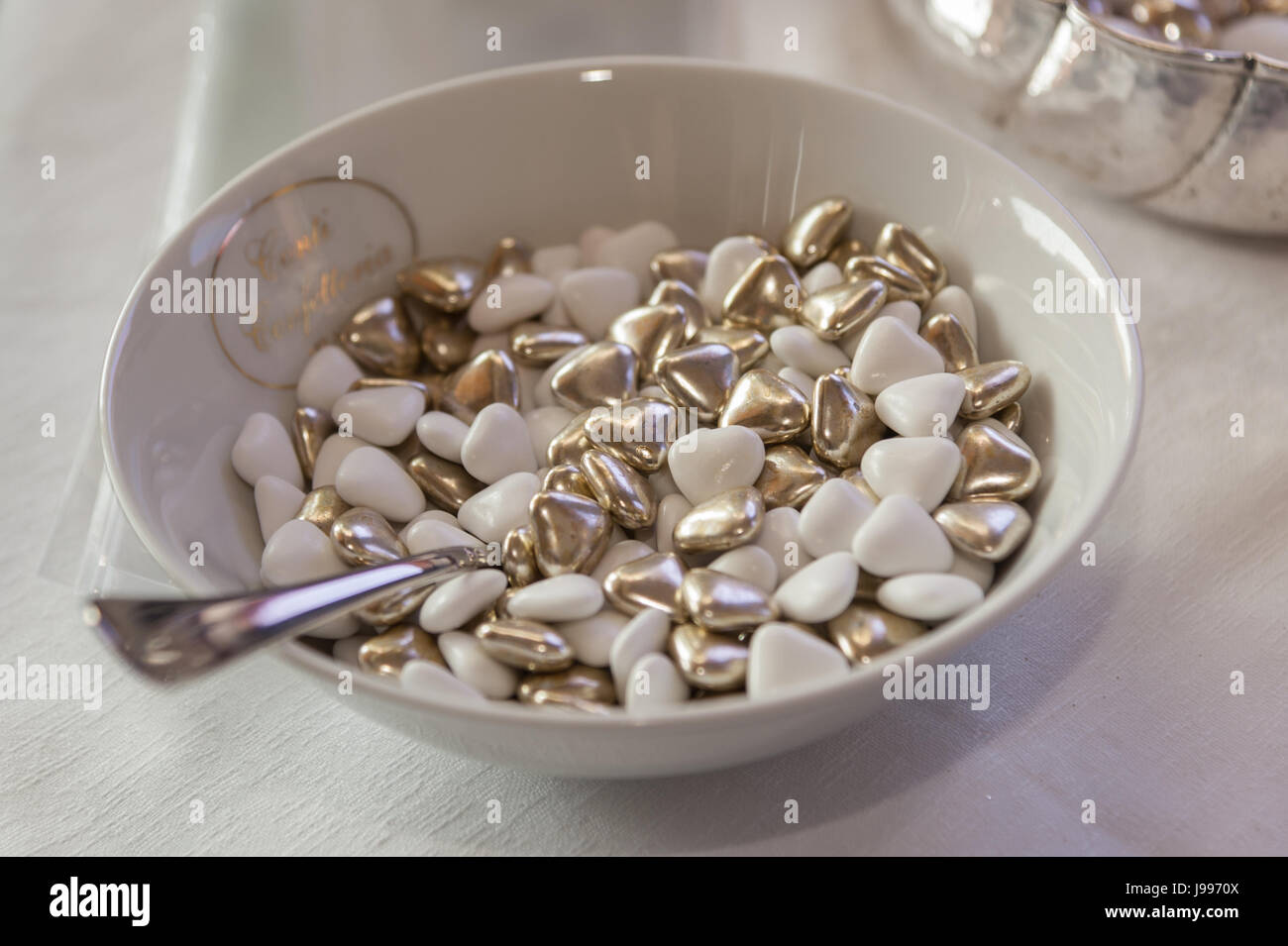 Heap of white and gold sugared almonds Italy Stock Photo Alamy