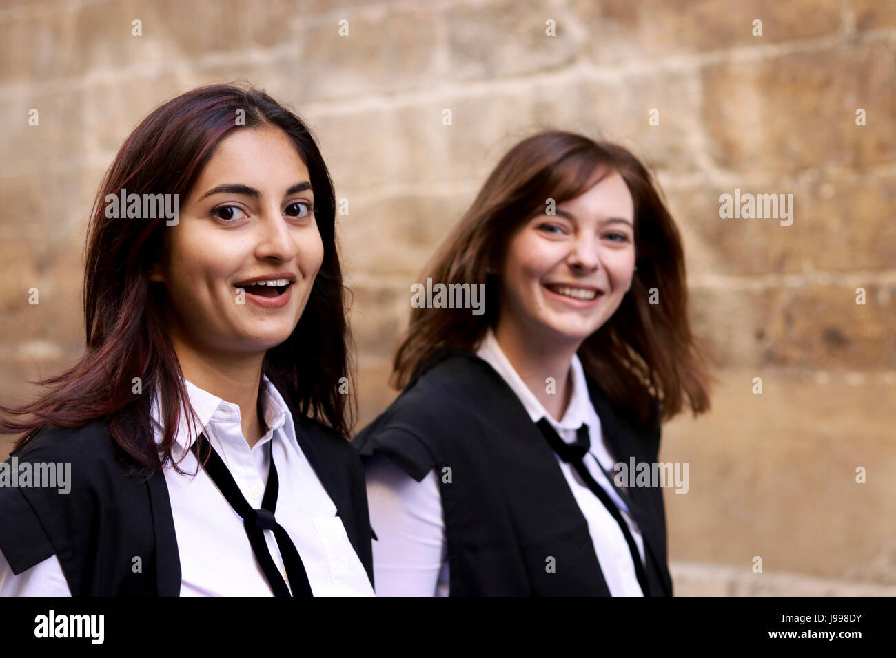 Two Oxford University female students happy and smiling after the  Matriculation ceremony, wearing their gown and "subfusc Stock Photo - Alamy