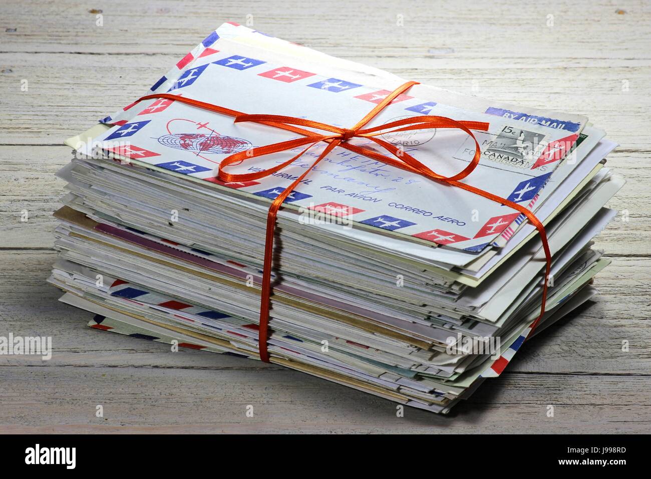 bundle of old letters on wooden background Stock Photo