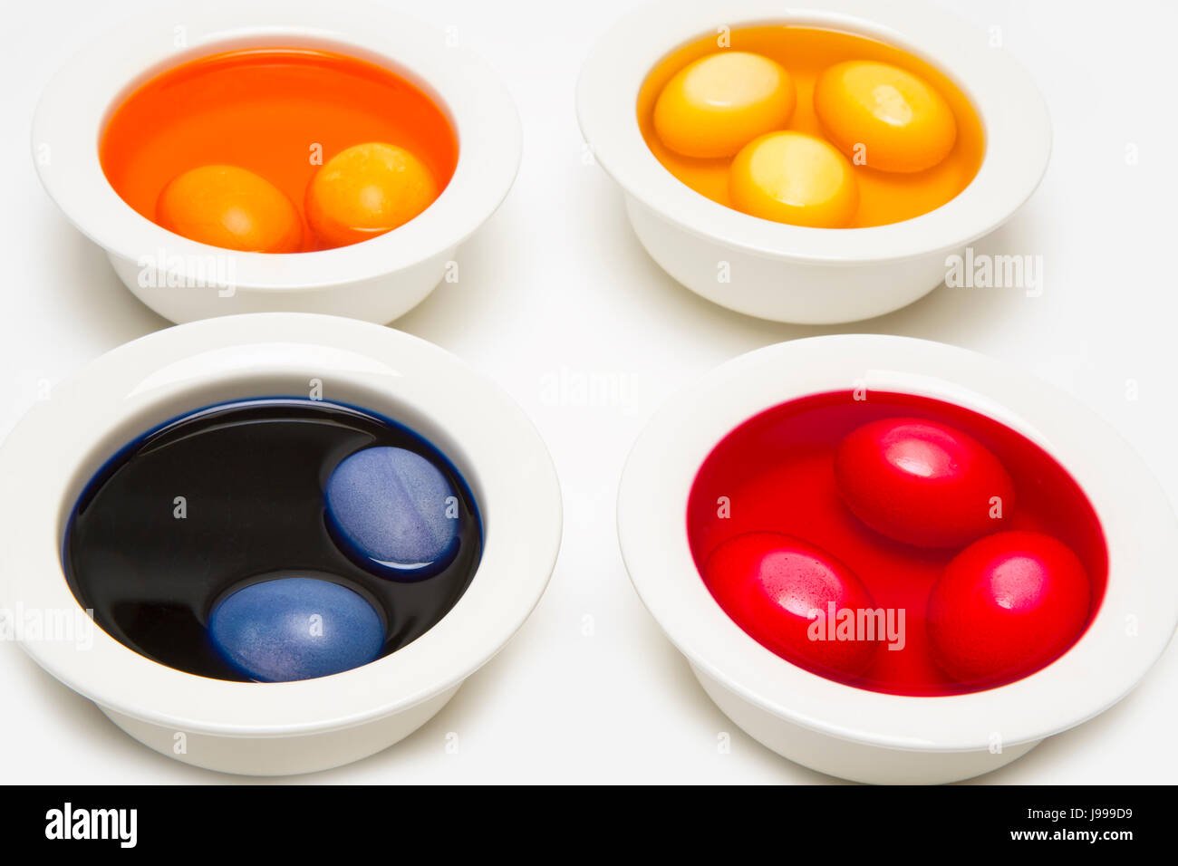 bowls with dyed easter eggs Stock Photo