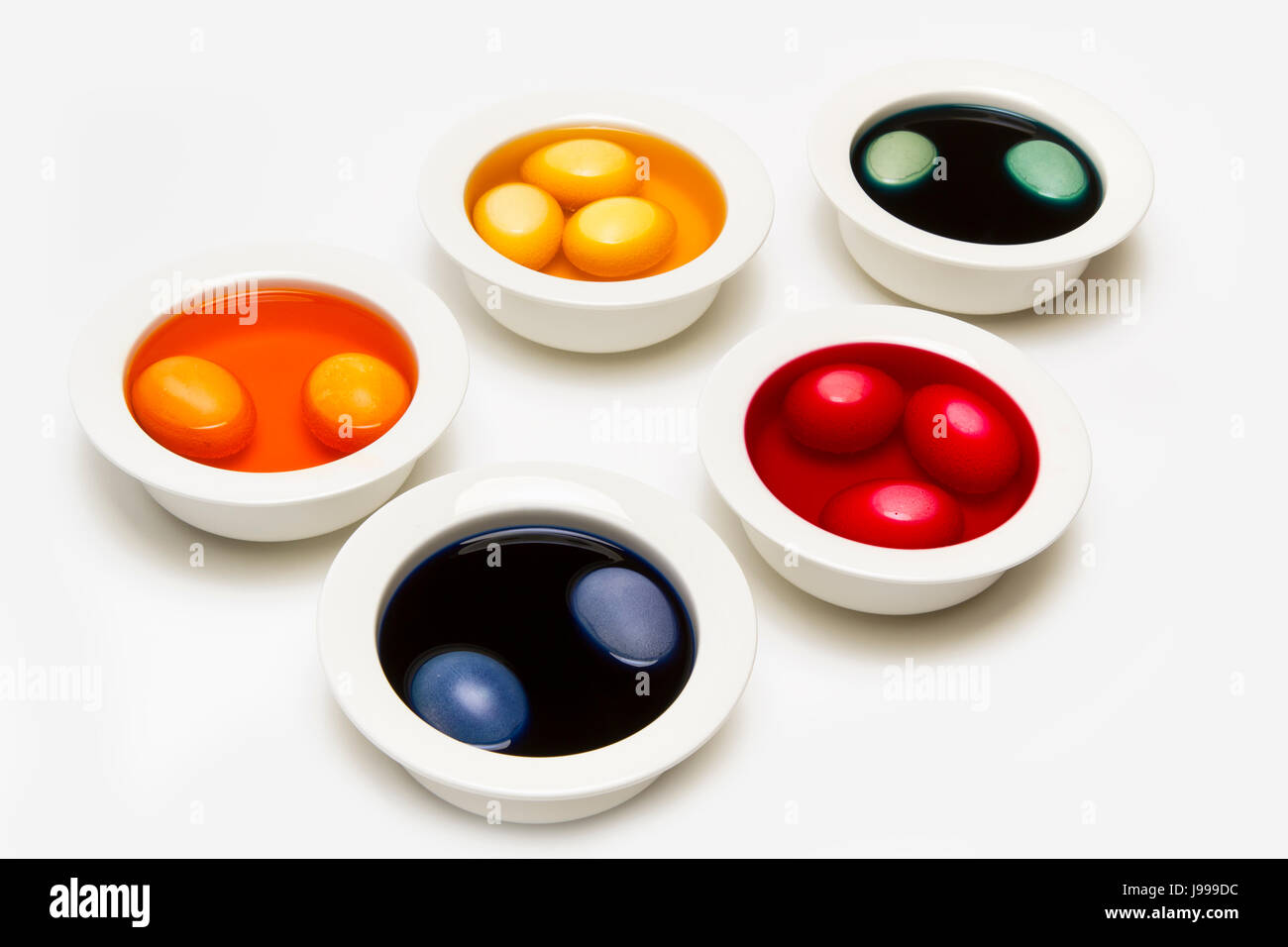 bowls with dyed easter eggs Stock Photo