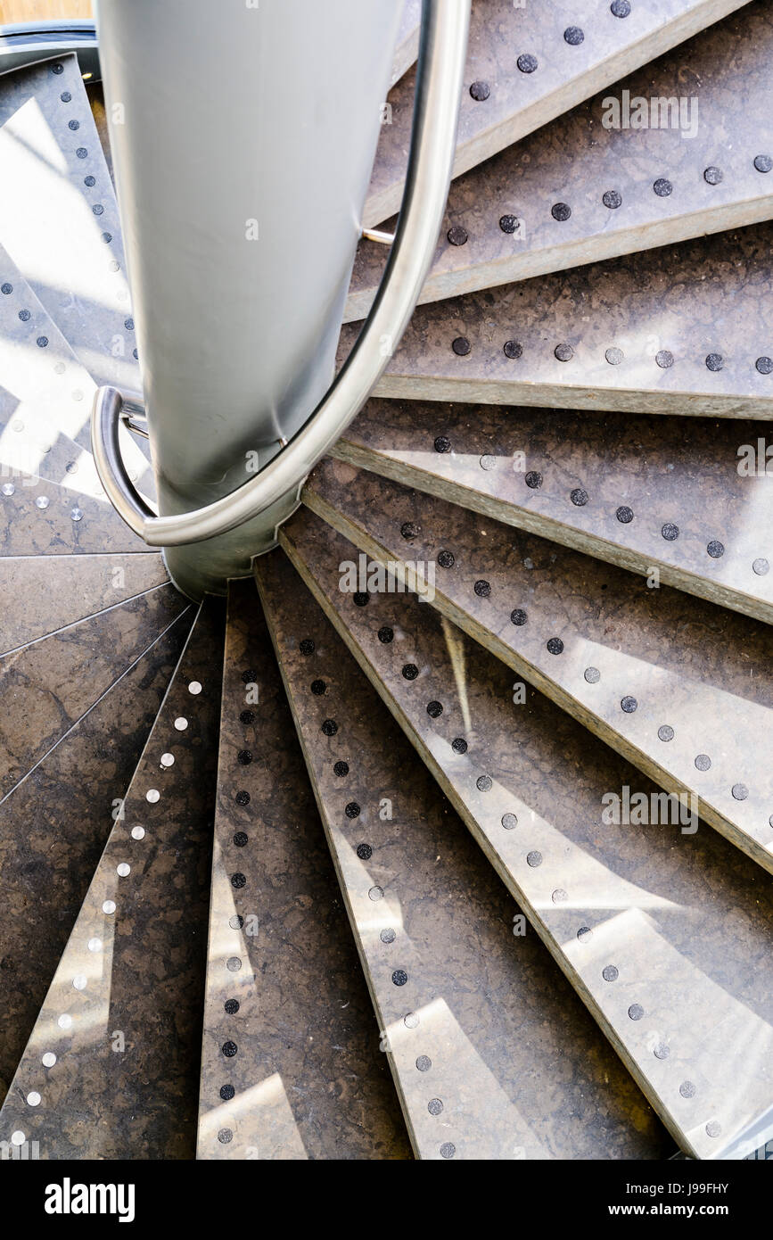 Spiral staircase and handrail in a hotel. Stock Photo
