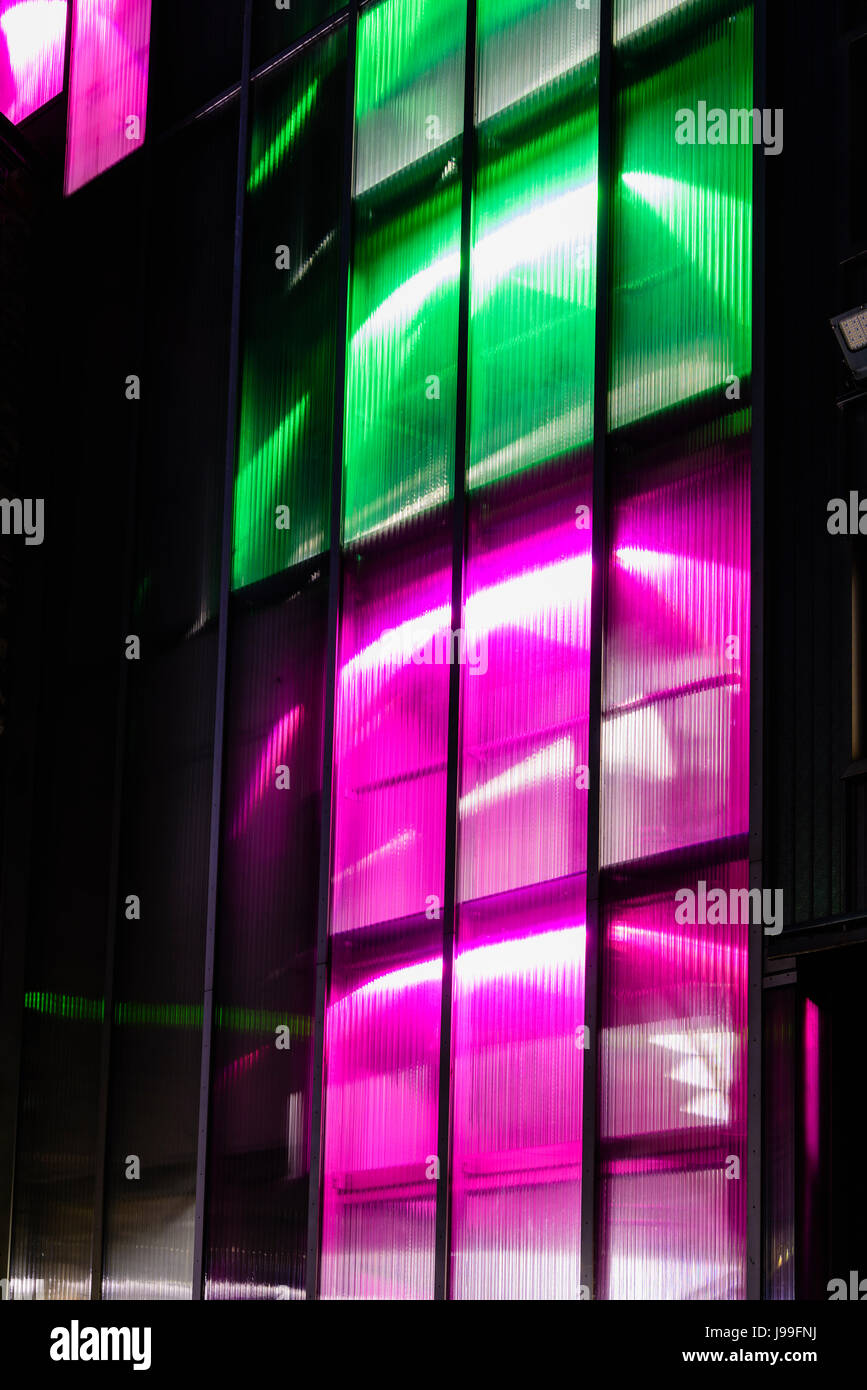 Multicoloured lights outside the 3 Arena at night, formerly the O2 Arena, and the Point Depot, a major concert venue in Dublin, Ireland. Stock Photo