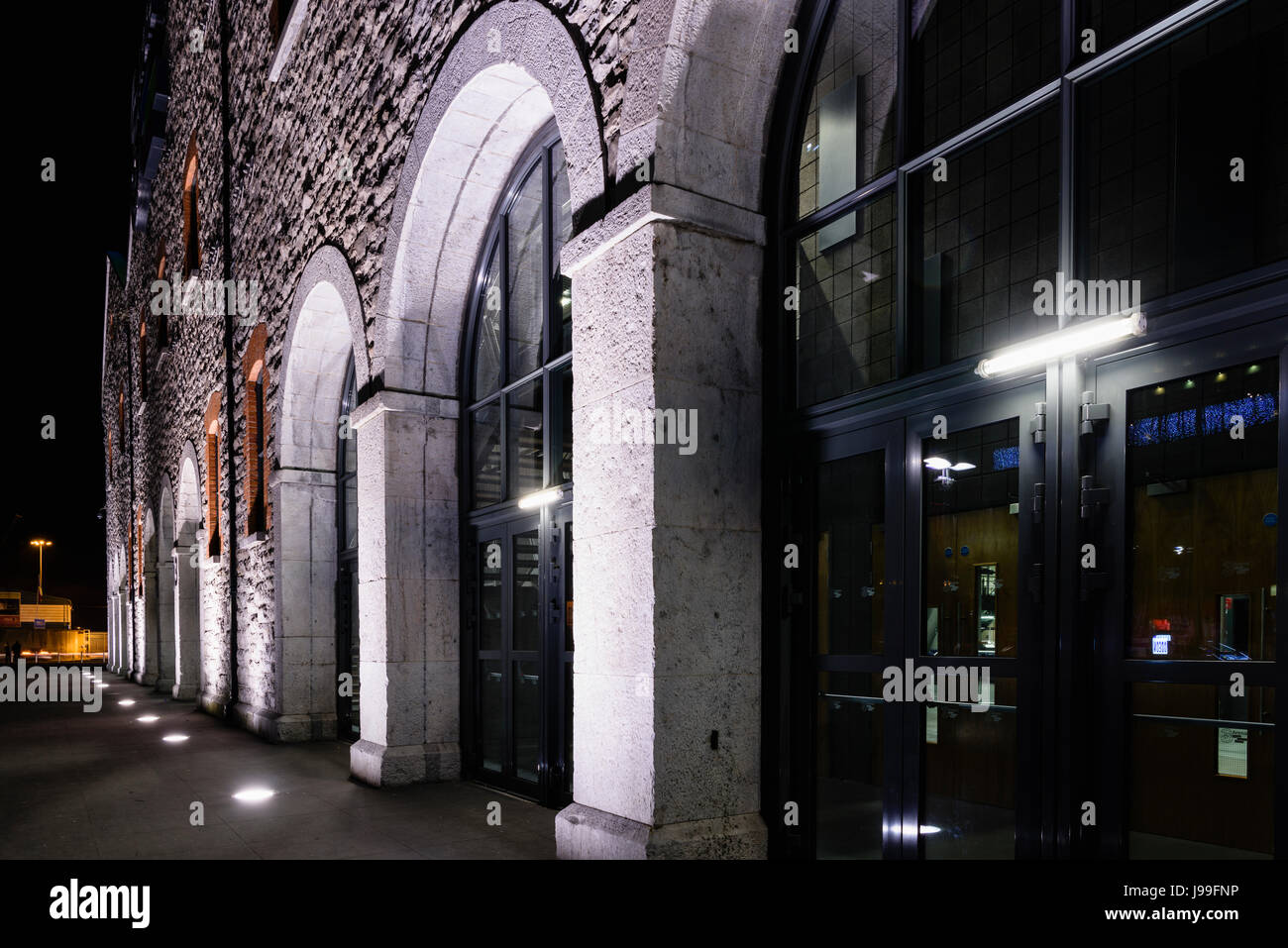 Entrance doors outside the 3 Arena at night, formerly the O2 Arena, and the Point Depot, a major concert venue in Dublin, Ireland. Stock Photo