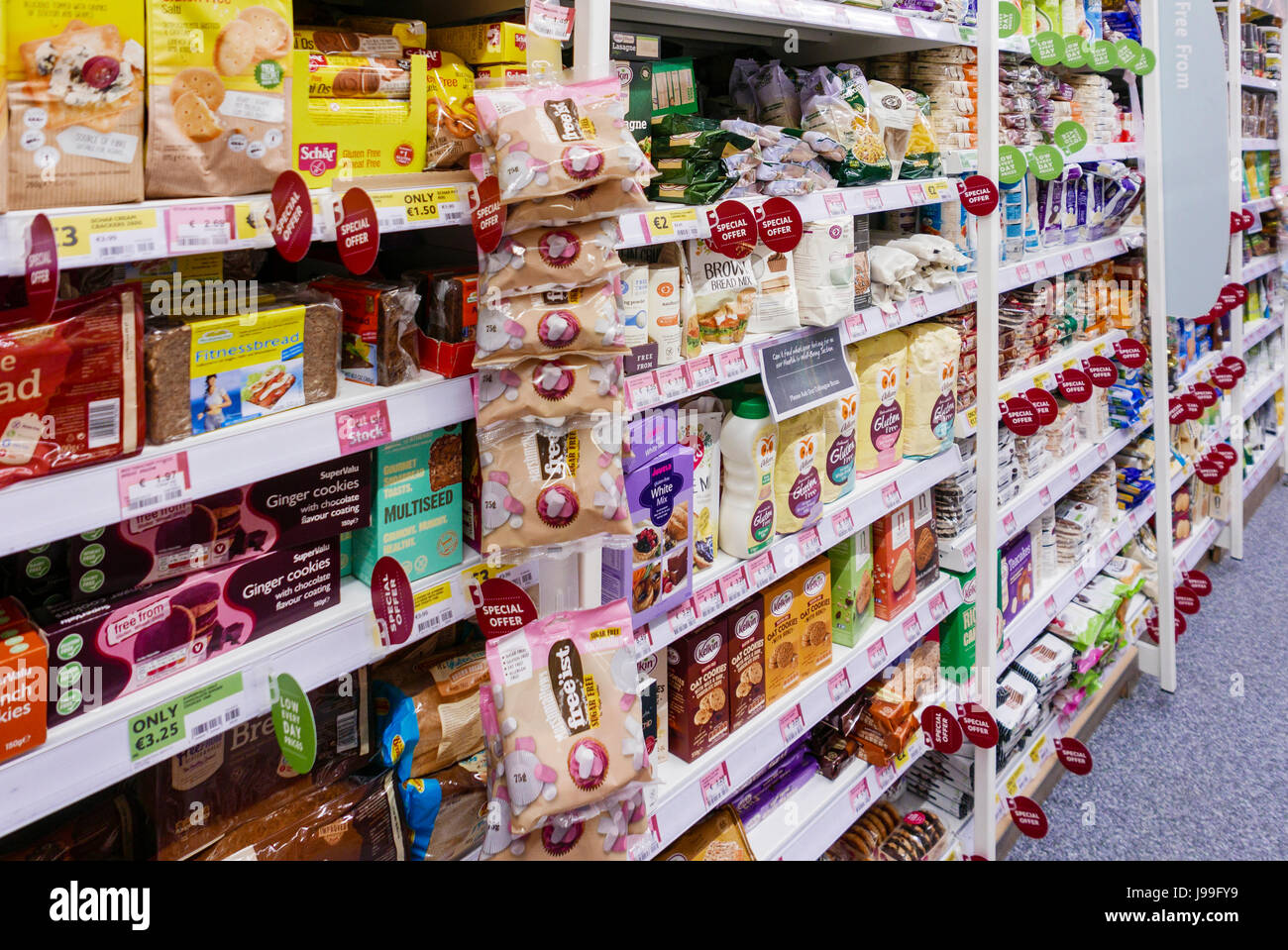 Gluten and dairy lactose free products at the free-from section of a supermarket. Stock Photo