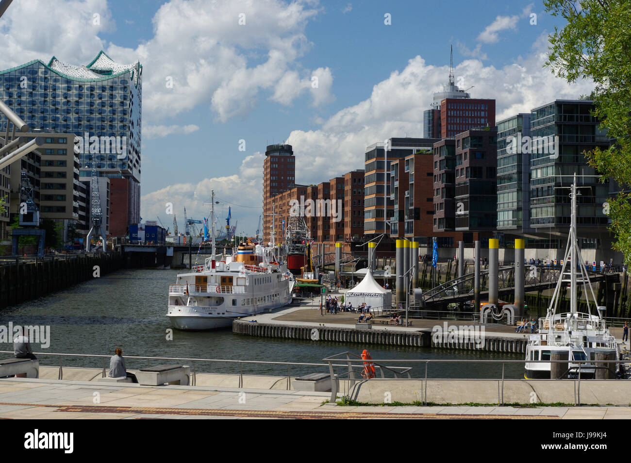 HAMBURG, GERMANY - JULY 18, 2015: the canal of Historic Speicherstadt houses and bridges at evening with amaising skyview over warehouses, famous place Elbe river. Stock Photo