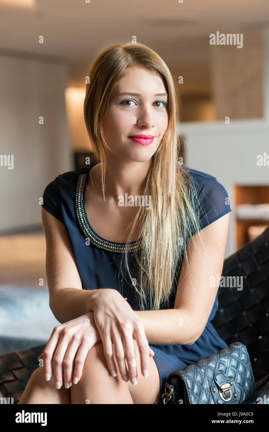 Beautiful young lady in her twenties, posing in fashion style. Stock Photo