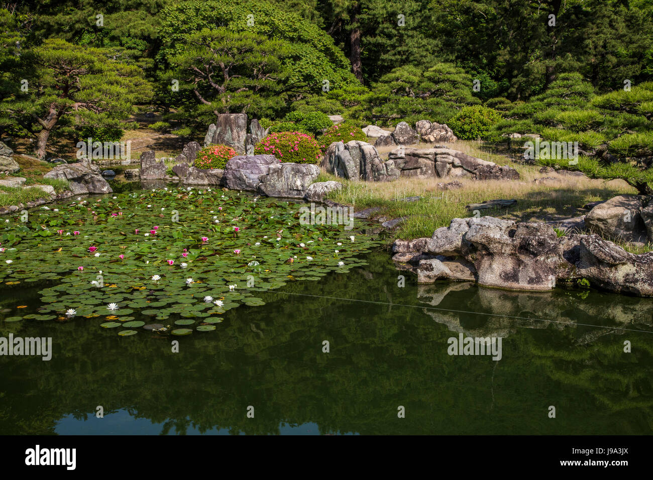 Ritsurin Pond Garden - Ritsurin Garden is a landscape garden in Takamatsu  built by the local feudal lords during the Edo Period. Considered one of th Stock Photo