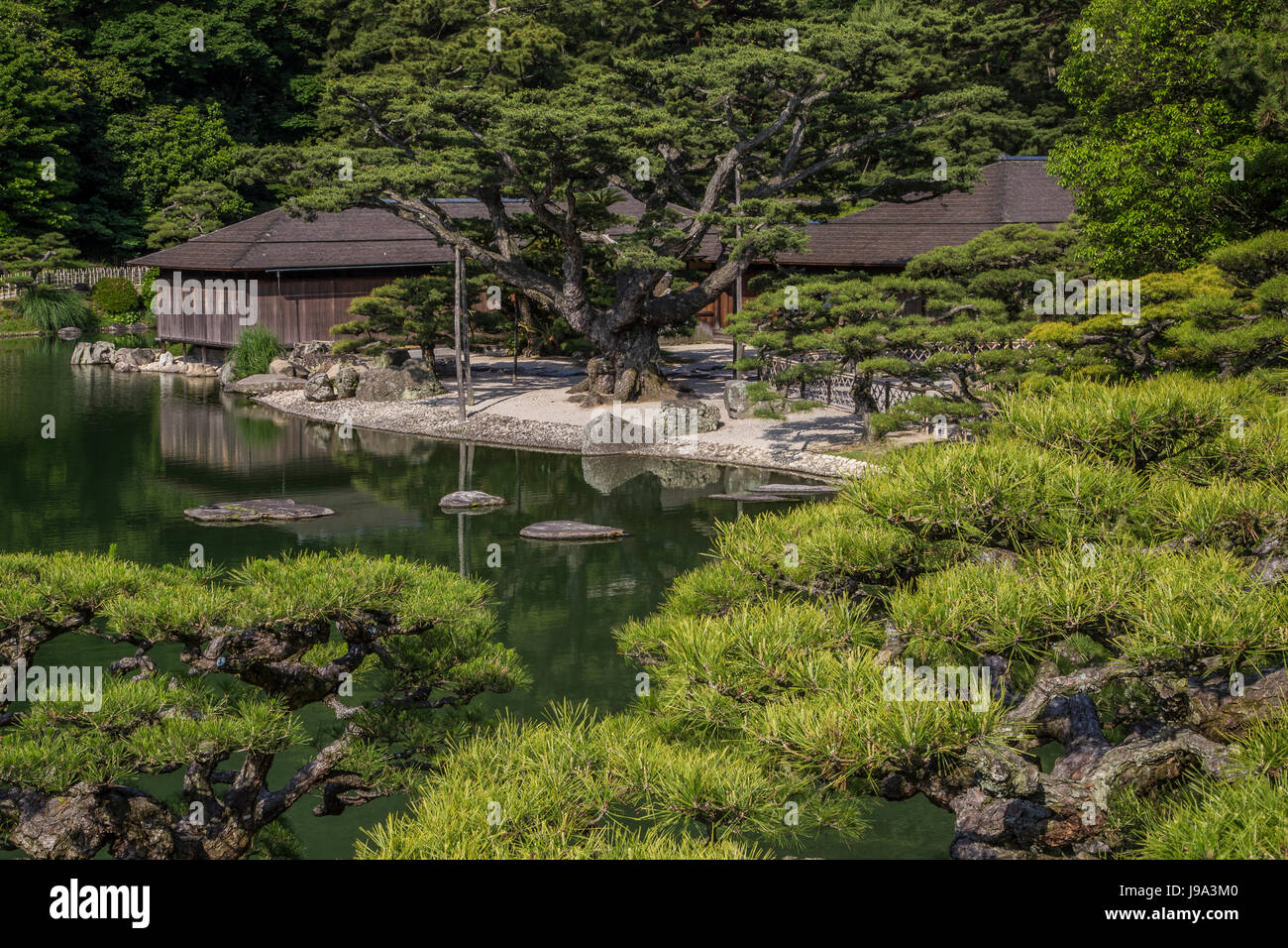 Kikugetsu-tei is a traditional Japanese sukiya teahouse, on the shores of Nanko South Pond, at Ritsurin, one of Japan's most beautiful gardens. Ritsur Stock Photo