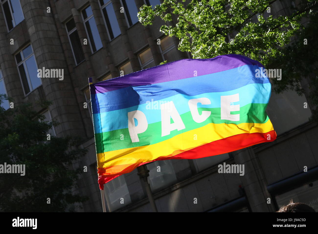 Hamburg, Germany, 31st May, 2017. Protesters waving a 'pace' flag during a demonstration against the G20 summit held at Moenckebergstrasse, Hamburg, Germany, 31.05.2017. Credit: Christopher Tamcke/AlamyLiveNews Stock Photo