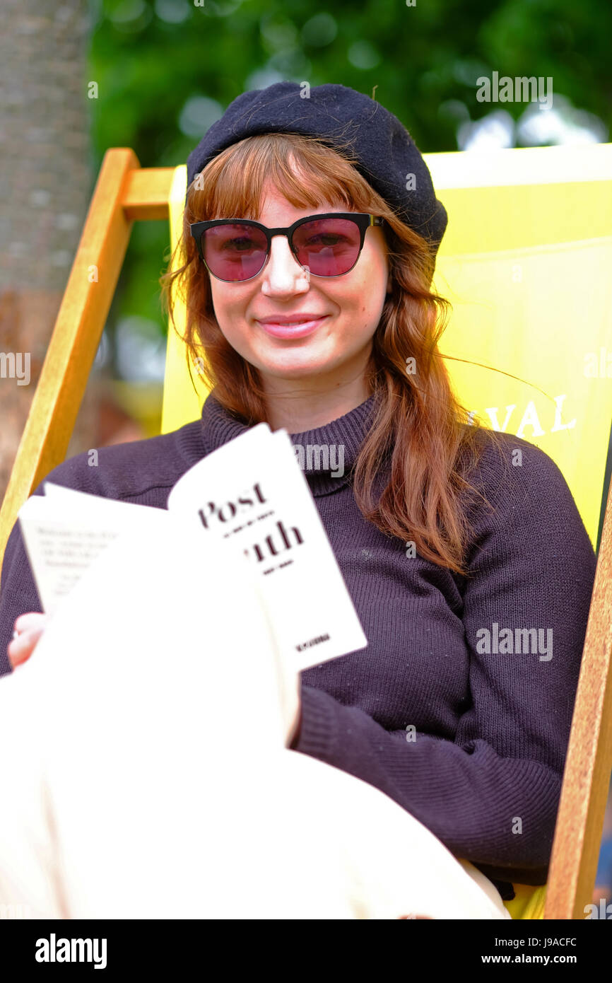 Hay Festival 2017 - Hay on Wye, Wales, UK - June 2017 - Hay Fashion - A visitor reads her copy of Post Truth by Matthew D'Ancona in a deckchair at the Hay Festival on Day 8 on this years event - the Hay Festival celebrates its 30th anniversary in 2017 - the literary festival runs until Sunday June 4th. Credit: Steven May/Alamy Live News Stock Photo