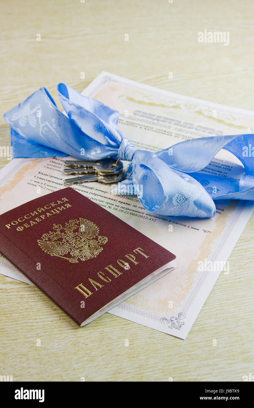 testifying to the right of ownership on the real estate, keys and passport Stock Photo