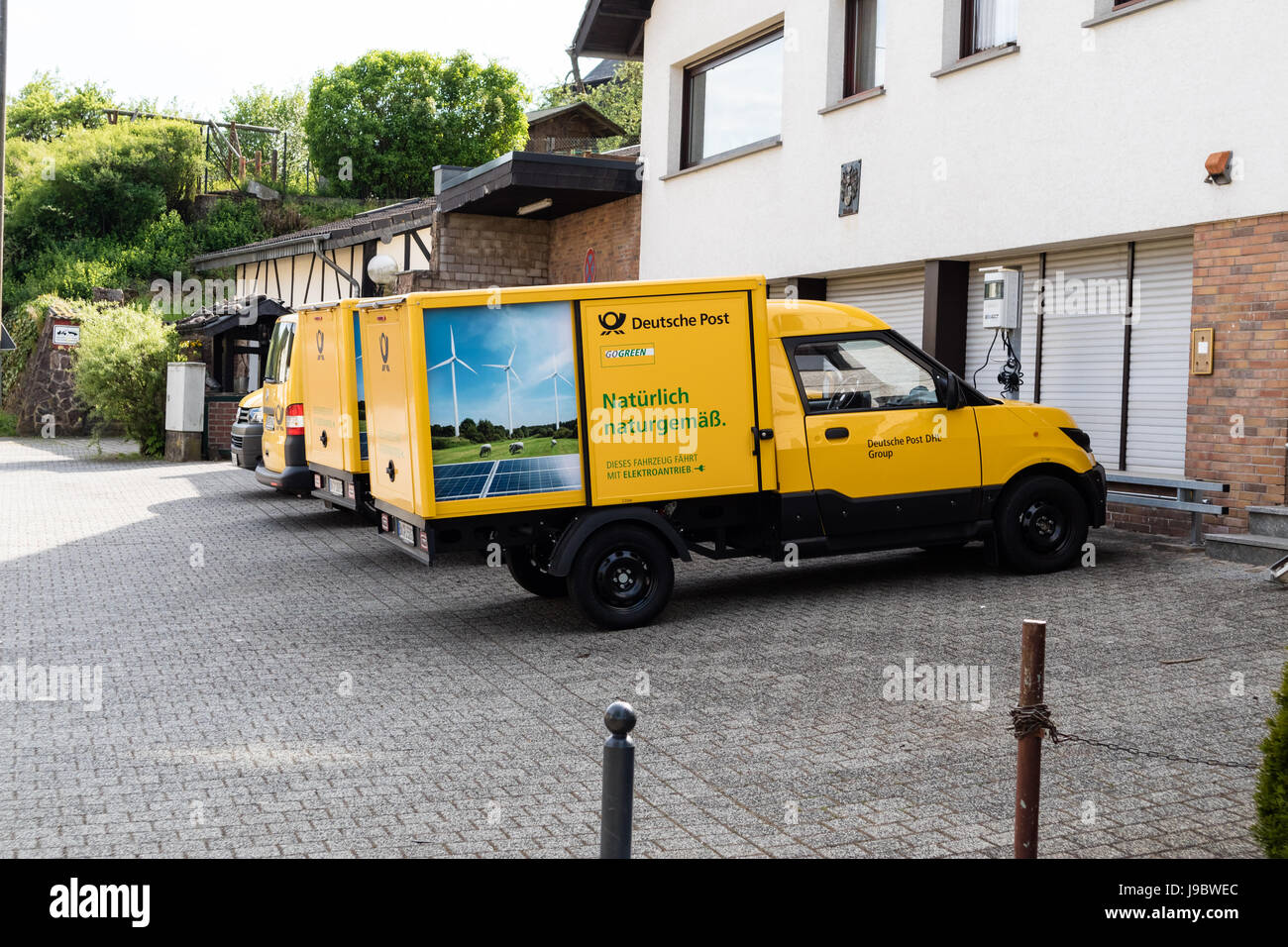 Two 'Streetscooter' - electric car with square box from Deutsche Post DHL - Nettersheim, North Rhine Westphalia, NRW, Germany, Europe Stock Photo
