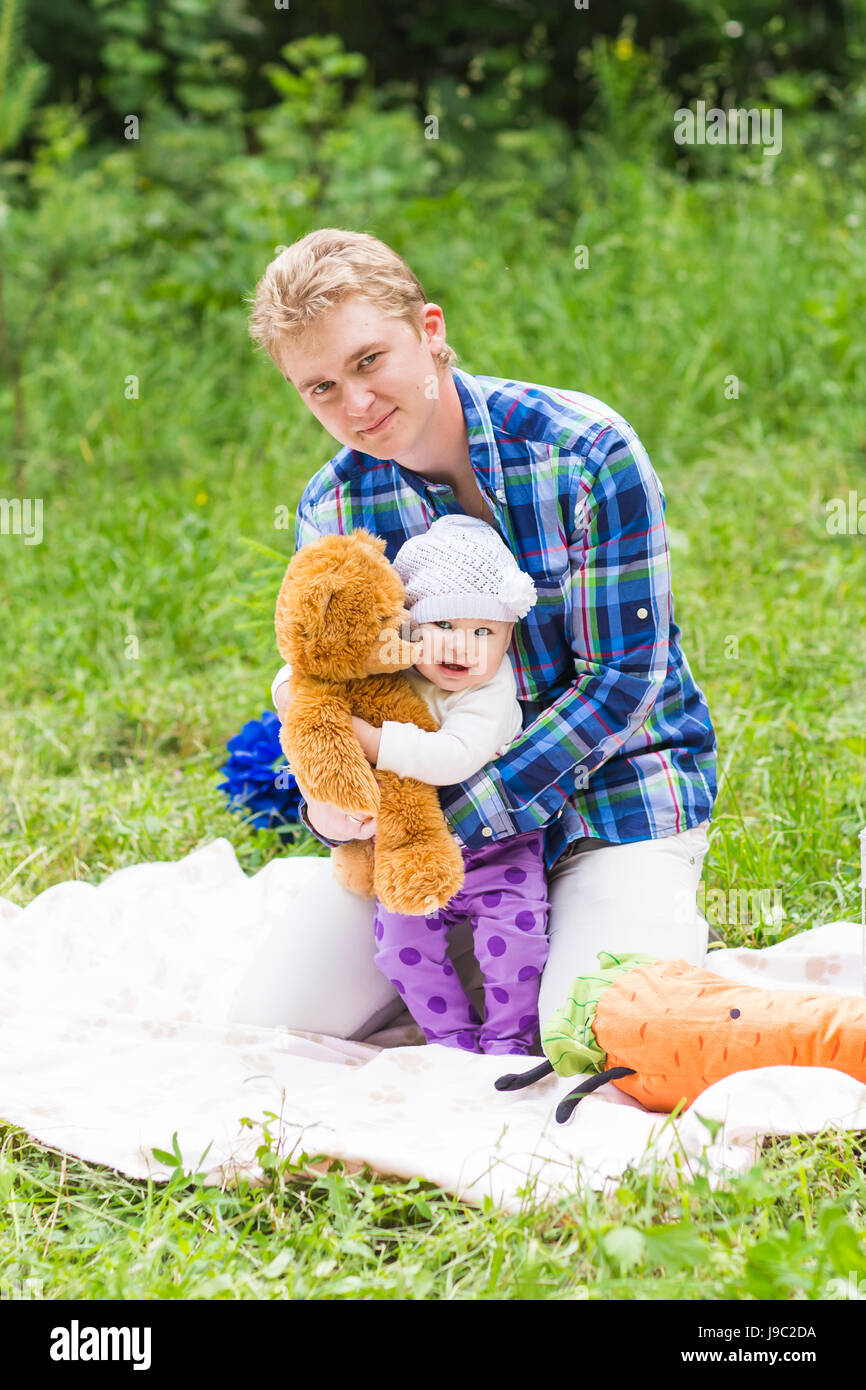 Happy father with baby daughter in summer park Stock Photo - Alamy
