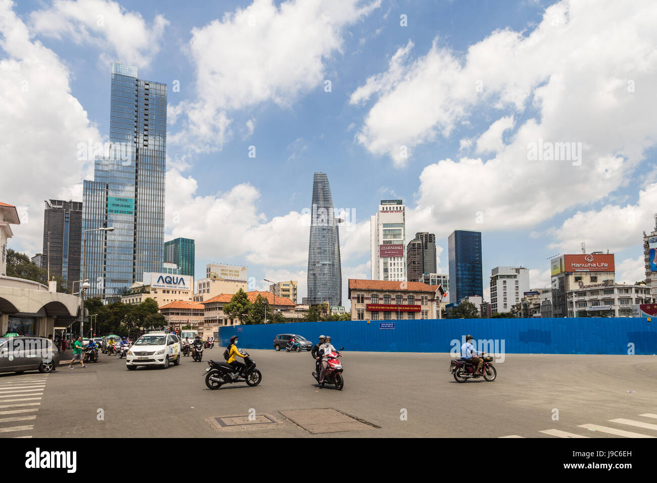 HO CHI MINH CITY, VIETNAM - APRIL 9, 2017: Cars and motorcycles drive in front of the famous Ben Thanh market in the heart of Ho Chi Minh City, the la Stock Photo