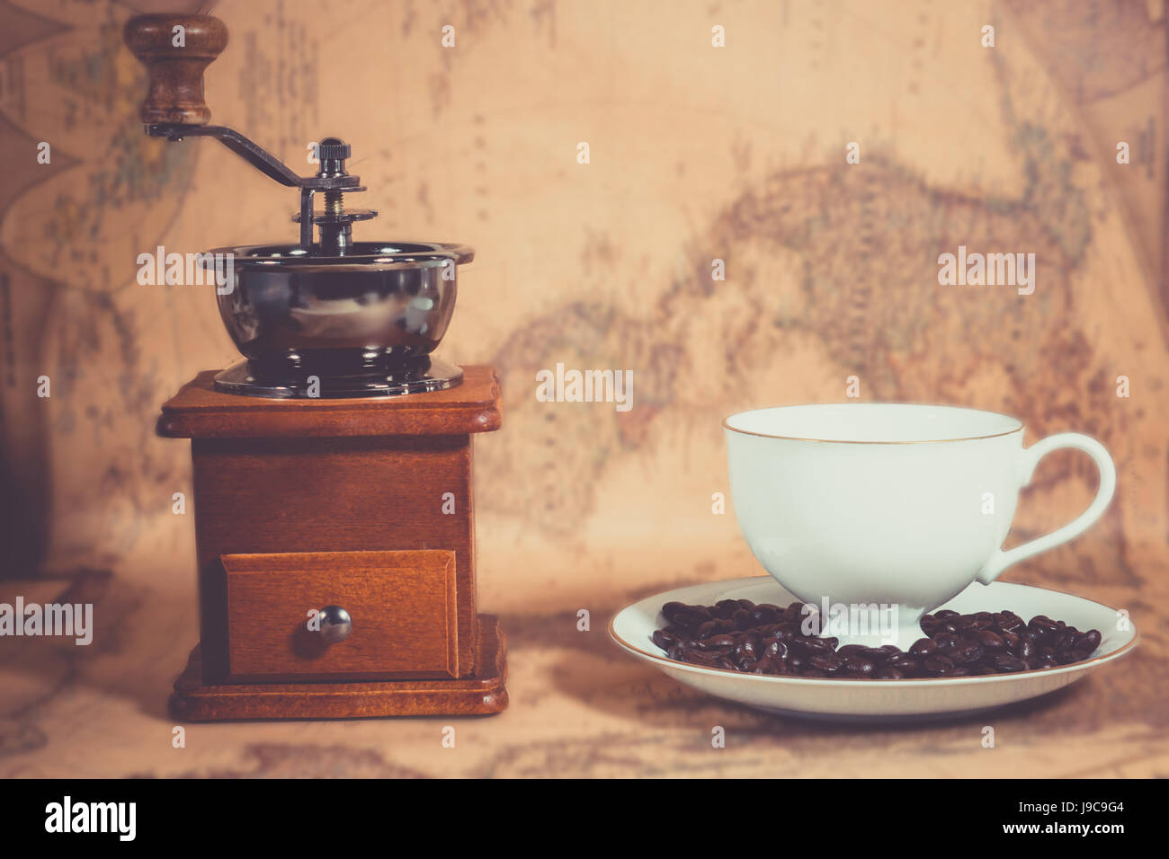 https://c8.alamy.com/comp/J9C9G4/coffee-grinder-coffee-cup-on-the-map-J9C9G4.jpg