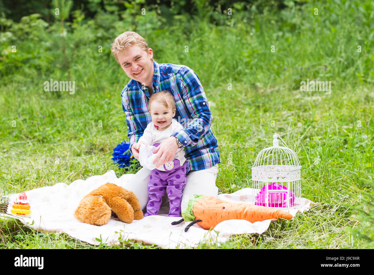 Happy father with baby daughter in summer park Stock Photo - Alamy