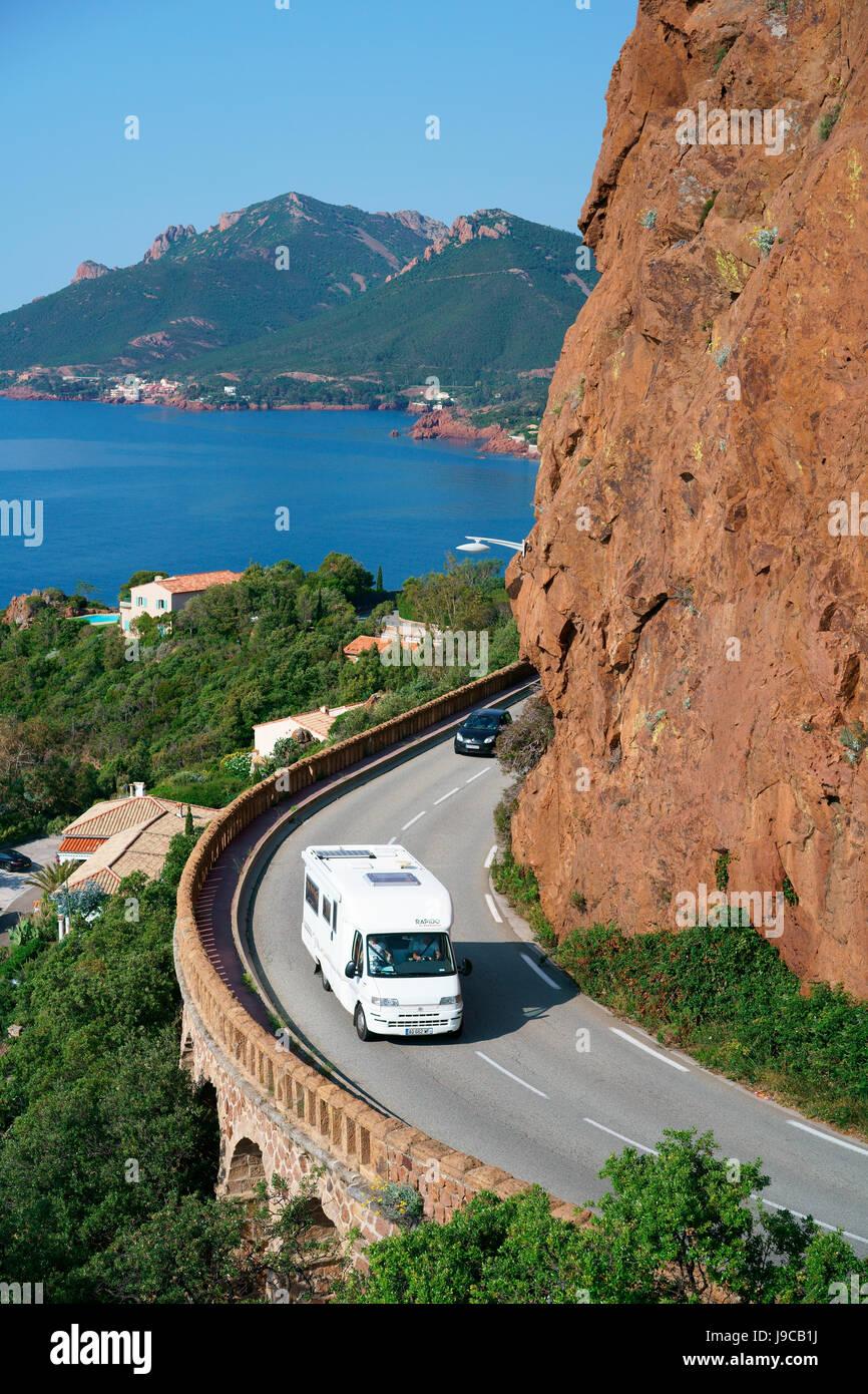 Recreational vehicle cruising on a scenic byway of the Esterel Massif. Théoule-sur-Mer, Alpes-Maritimes, French Riviera, France. Stock Photo