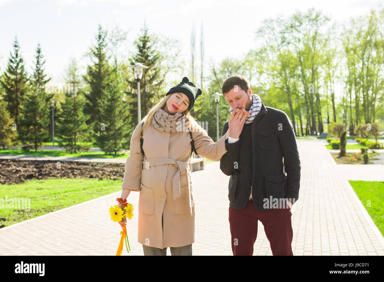 Happy pregnant woman and her husband in the park Stock Photo - Alamy