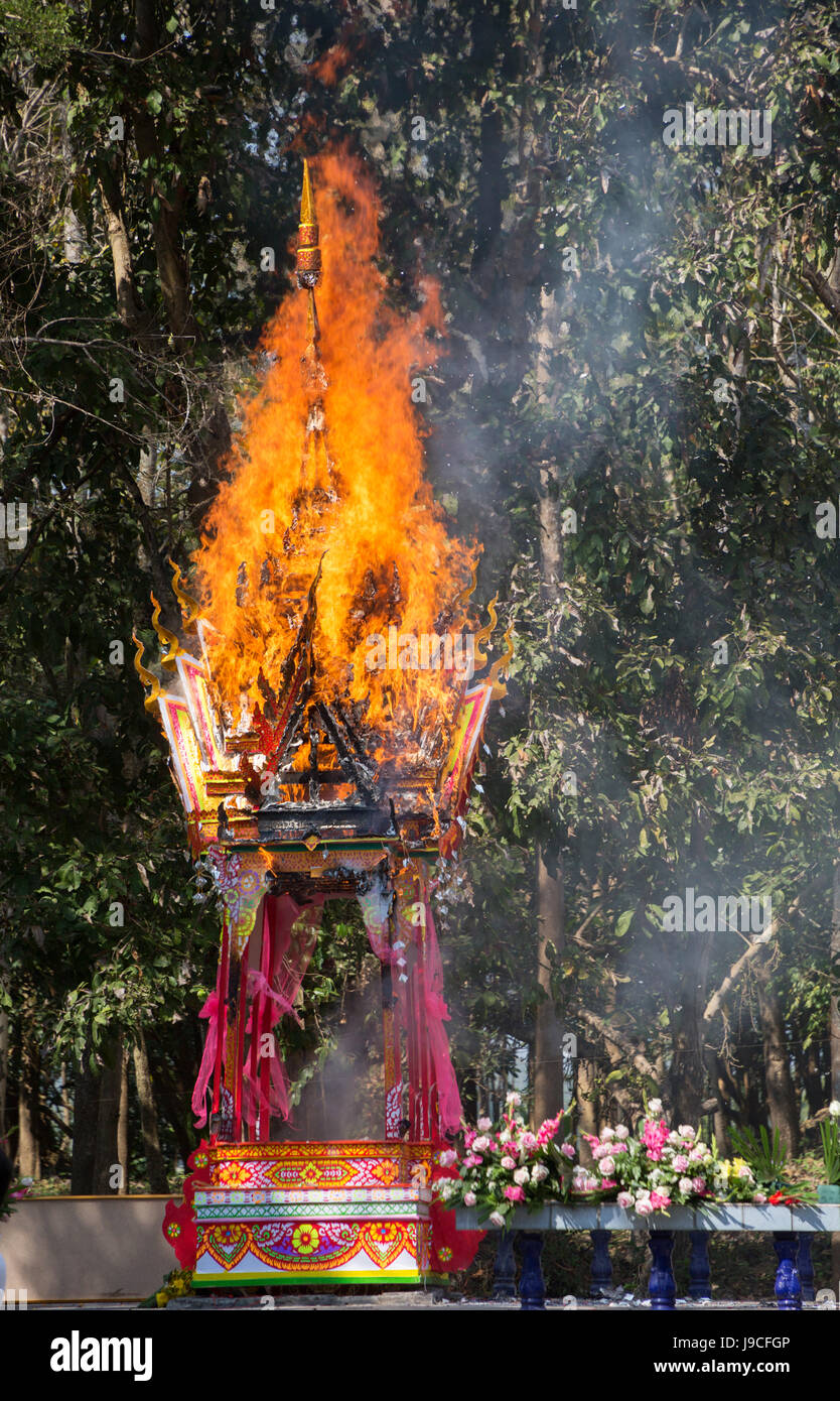 Burning of a symbolic paper house at a Buddhist funeral in the country near Chiang Mai Thailand Stock Photo