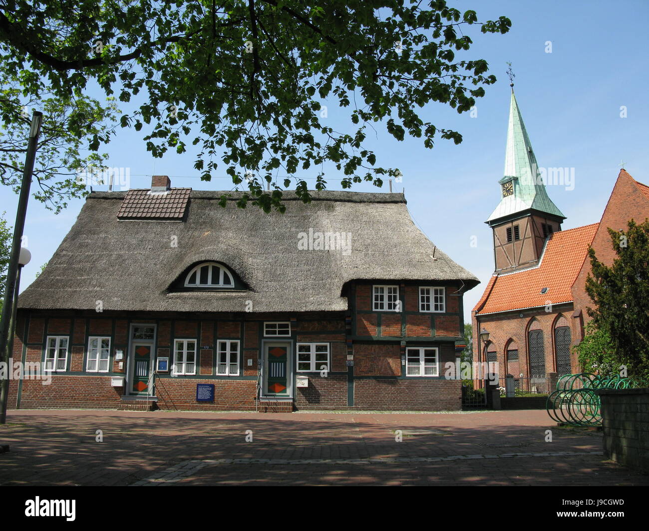 Kreuzkirche And Old Kusterhaus In Hamburg Wilhelmsburg Stock Photo