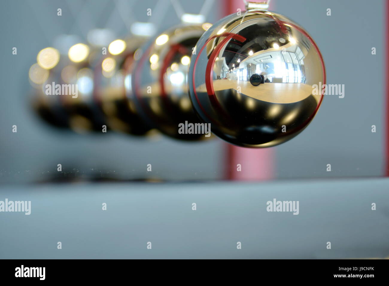 Close-up 5 Balls Pendulum, Newton's cradle, in different angels ...