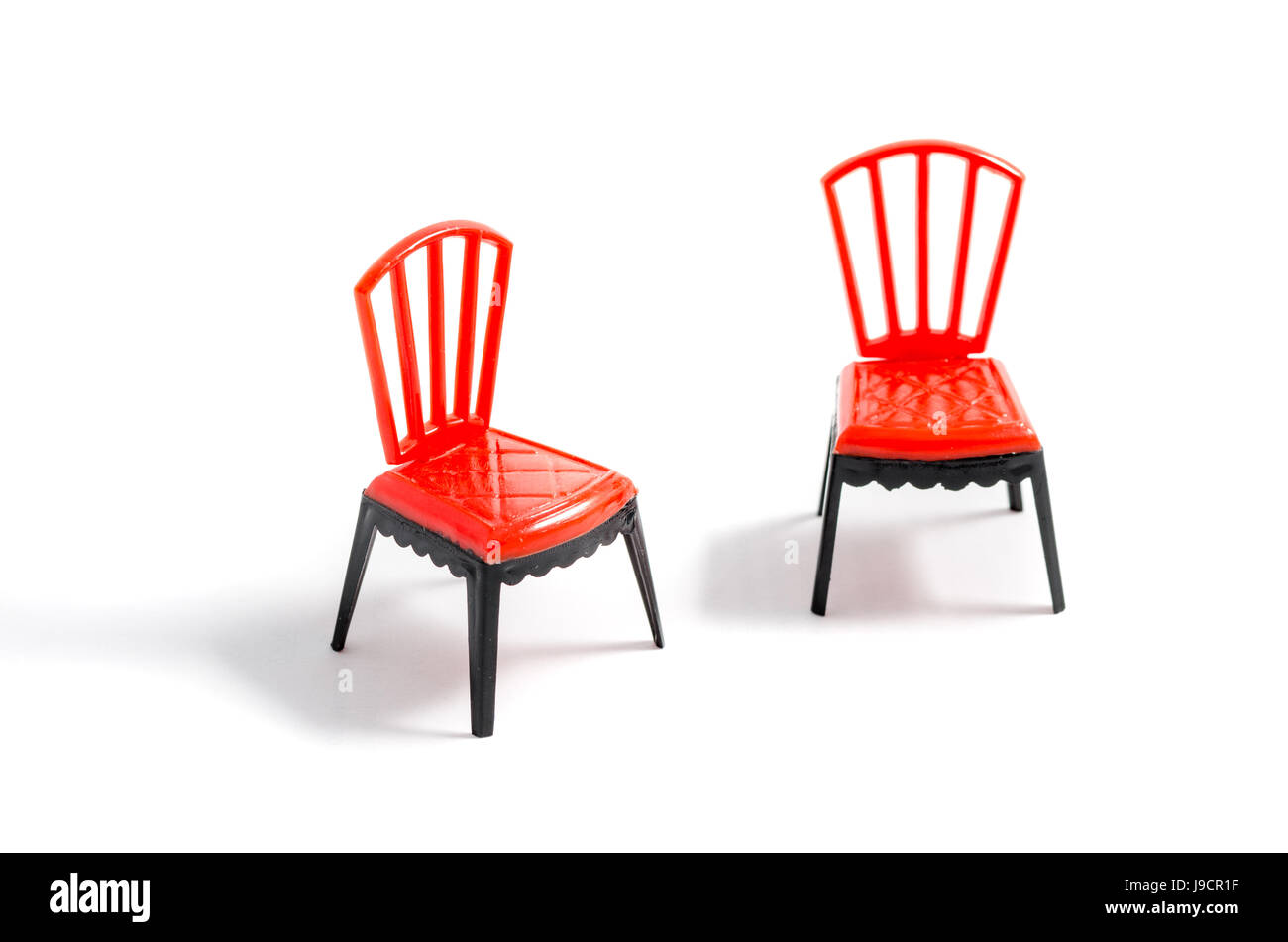 Red plastic chair on white background Stock Photo