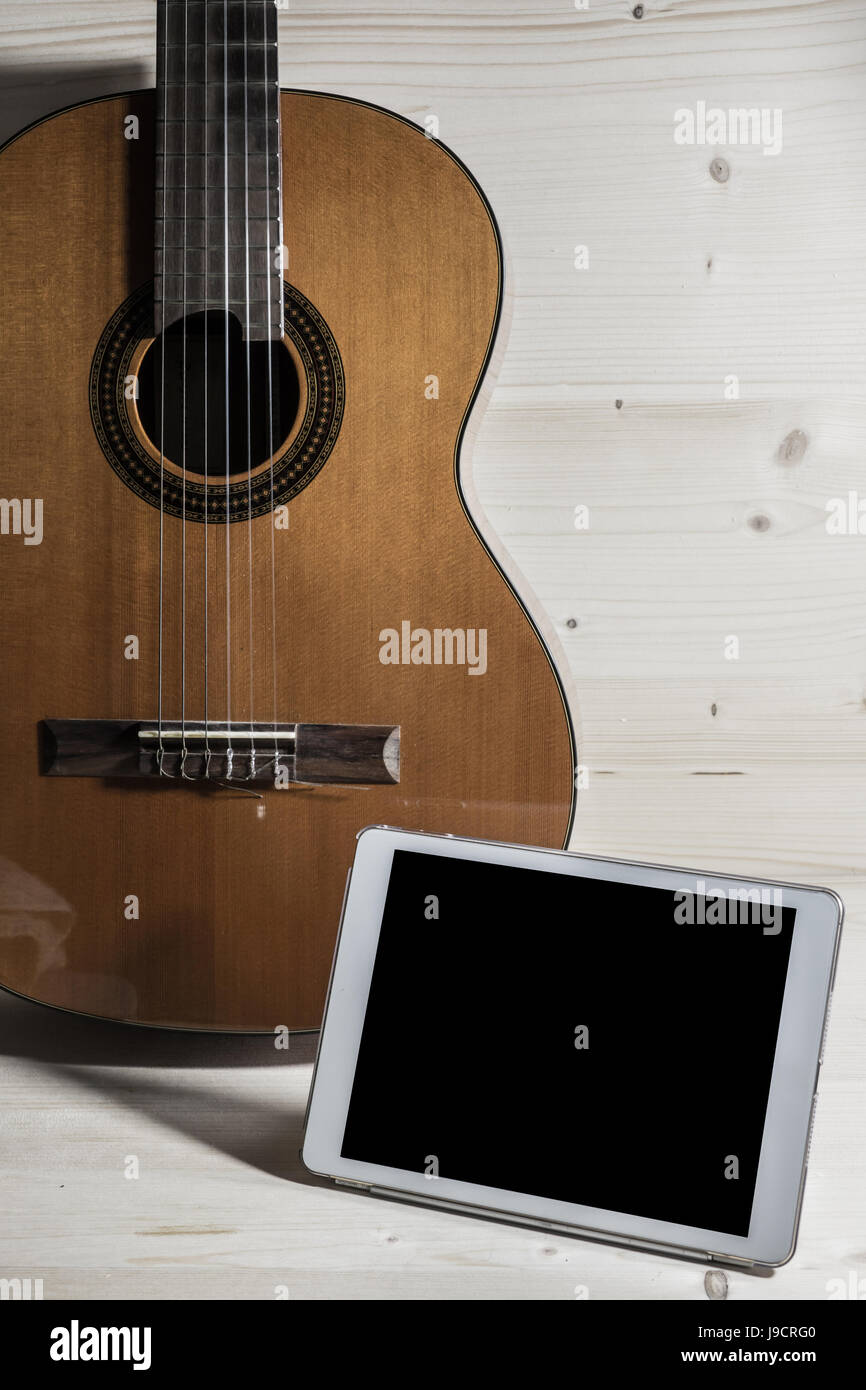 play guitar and composed songs using the tablet Stock Photo Alamy