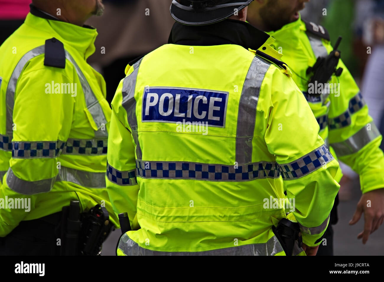 British Police Officer in high visibility uniform on crowd control