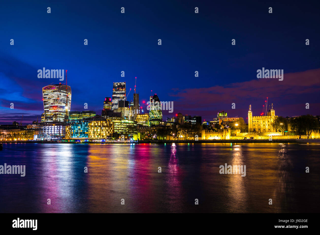 Skyline of the City of London, with the Tower of London, Gherkin, Leadenhall Building and Walkie Talkie Building, night shot Stock Photo