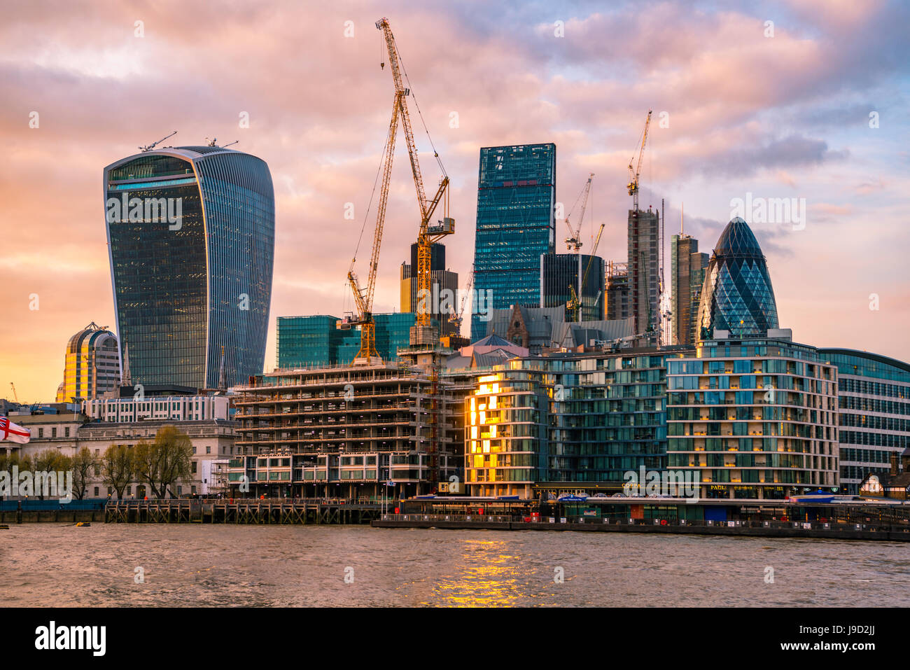 Skyline of the City of London, with Gherkin, Leadenhall Building and Walkie Talkie Building, at sunset, London, England Stock Photo