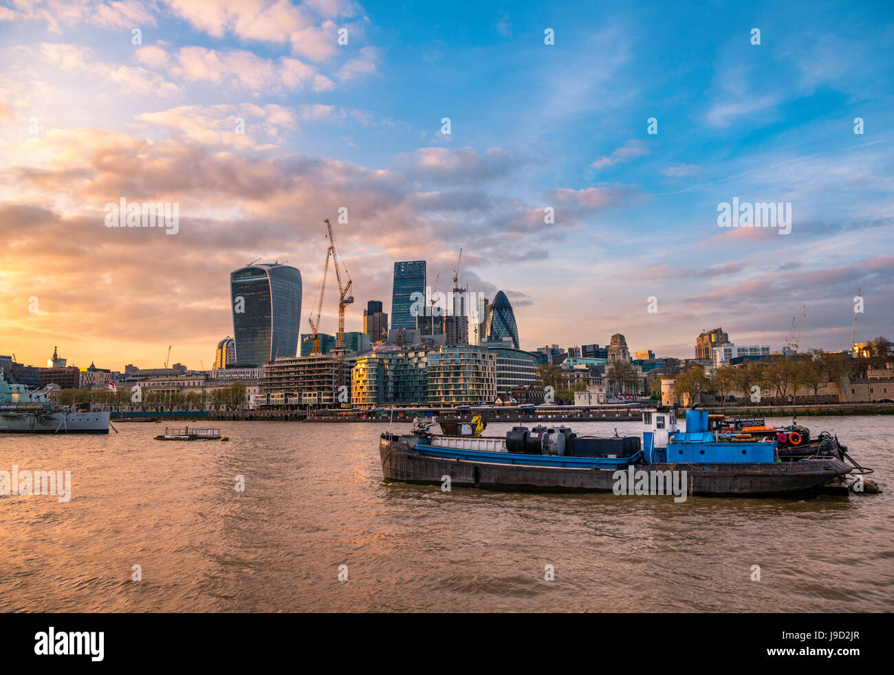 Skyline of the City of London, with Tower of London, Gherkin, Leadenhall Building and Walkie Talkie Building, at sunset, London Stock Photo