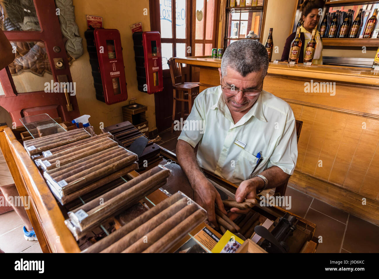 Hand rolling Cuban cigars in the UNESCO World Heritage Site city of Trinidad, Cuba, West Indies, Caribbean, Central America Stock Photo