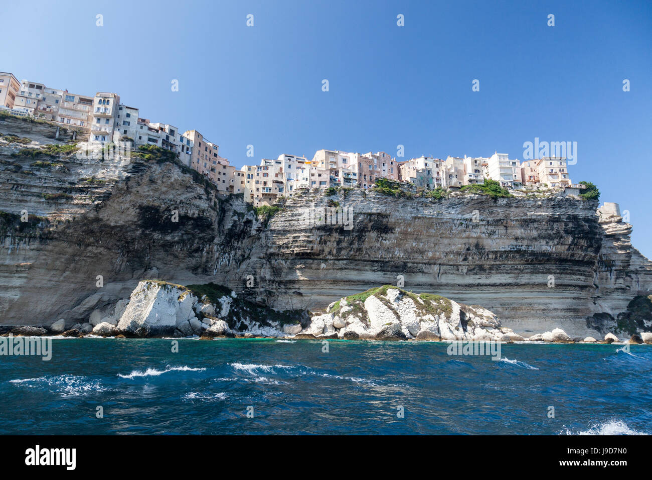 The turquoise sea frames the ancient village perched on the white cliffs, Bonifacio, Corsica, France, Mediterranean, Europe Stock Photo