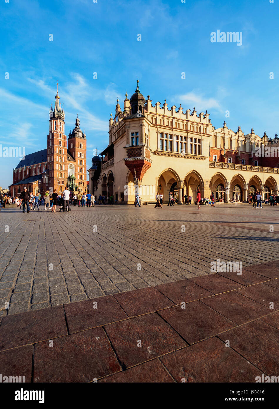 Main Market Square, St. Mary Basilica and Cloth Hall, Cracow, Lesser Poland Voivodeship, Poland, Europe Stock Photo