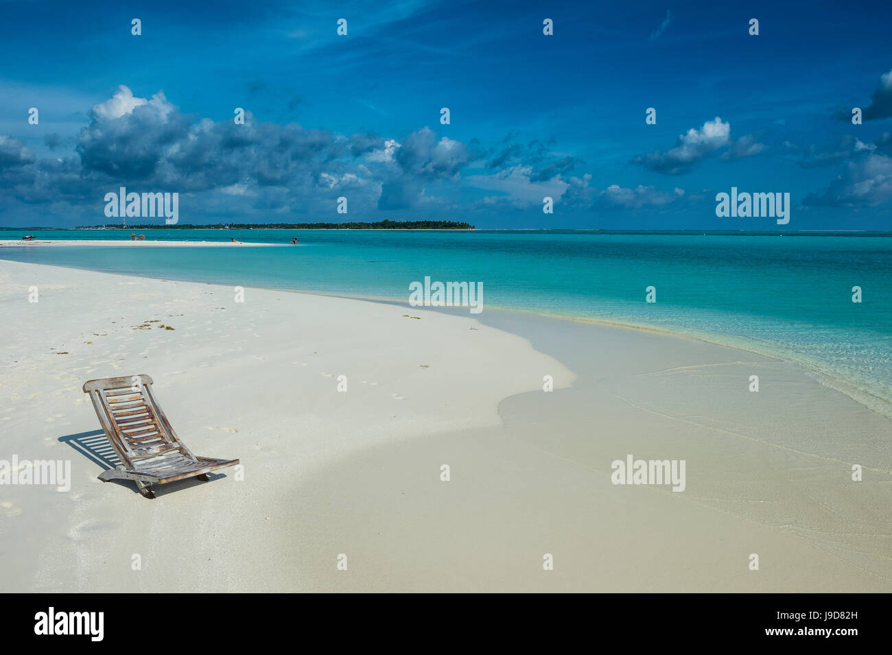 Sun chair on a white sand beach and turquoise water, Sun Island Resort, Nalaguraidhoo island, Ari atoll, Maldives, Indian Ocean Stock Photo