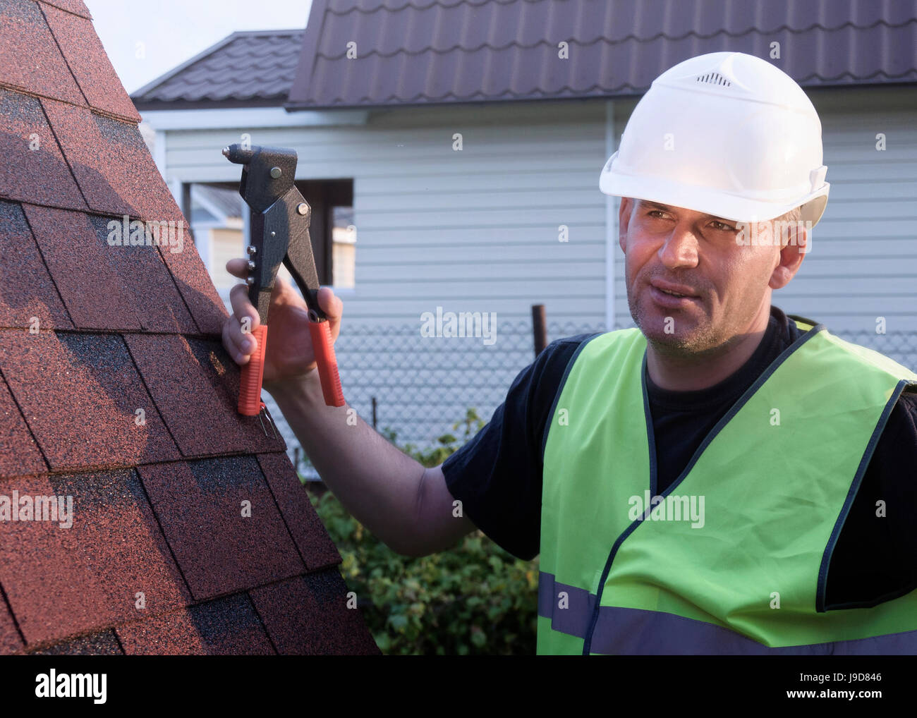 Roof shingles worker hi-res stock photography and images - Alamy