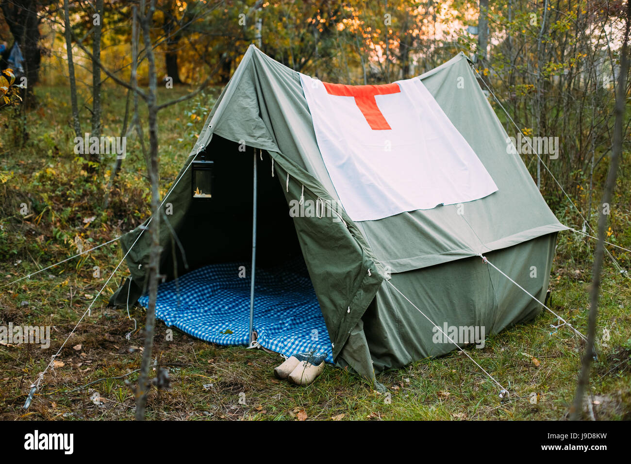 Camp Tent Of Military Medical Orderlies Of Infantry German Wehrmacht Infantry Soldiers During World War II In Forest Camp Re-enactors. Stock Photo