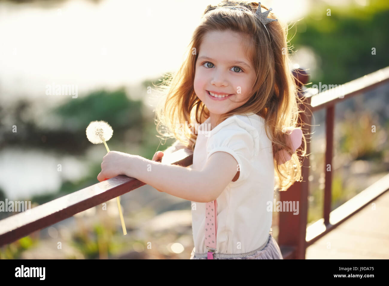 little girl with dandelion in park Stock Photo - Alamy