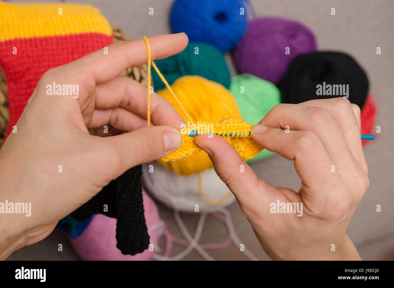 Close-up of hands knitting Stock Photo