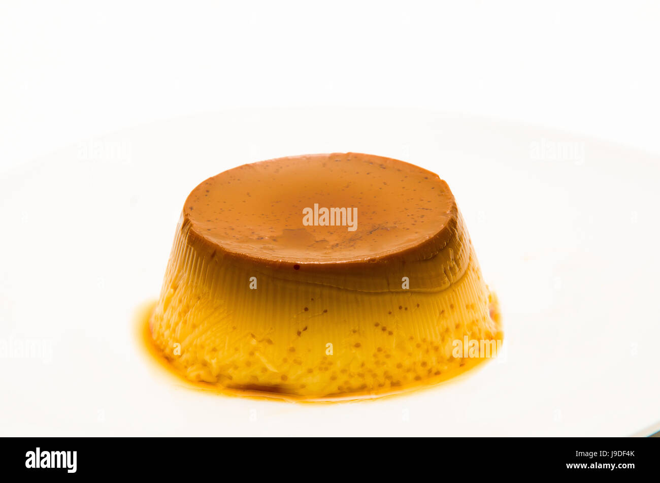 Closeup of creme caramel, caramel custard or flan on white background Stock Photo Alamy