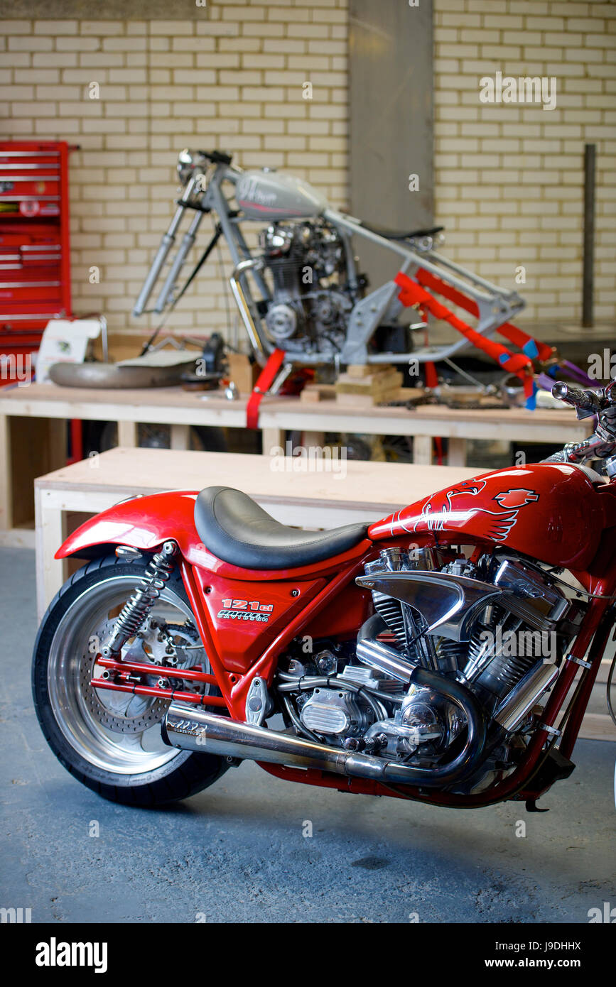 Two custom built motorcycles in a workshop space stock photo alamy