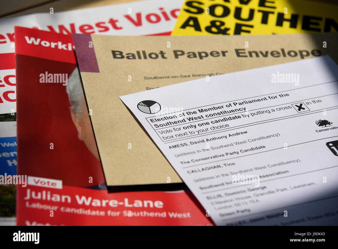 Postal ballot paper with envelope, local Southend West candidate Julian Ware-Lane pamphlet and Save Southend A&E leaflet, on table in natural light Stock Photo