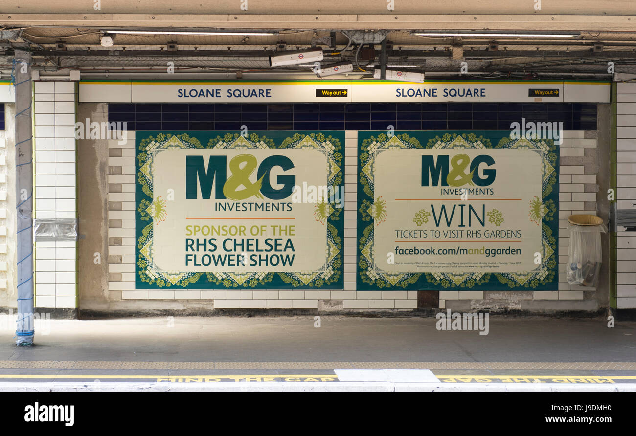 M&G Investments posters at Sloane Square underground station, sponsors of the RHS Chelsea Flower Show Stock Photo