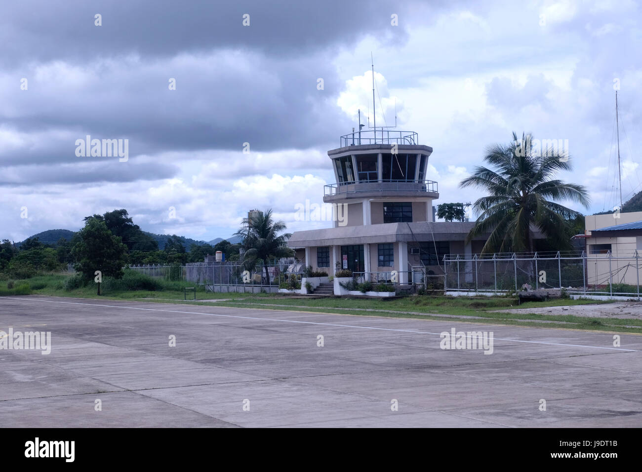 View of the air traffic control tower and small airport named Francisco B. Reyes in the town of Coron in the island of Busuanga in the Calamian Islands in northern Palawan of the Philippines Stock Photo
