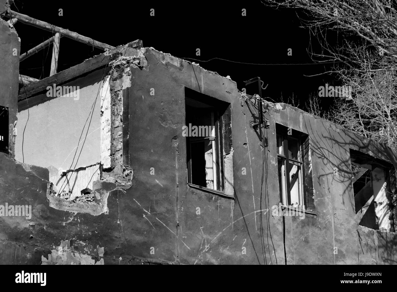 Destroyed Building. The beginning of a new day. Black and White Stock Photo